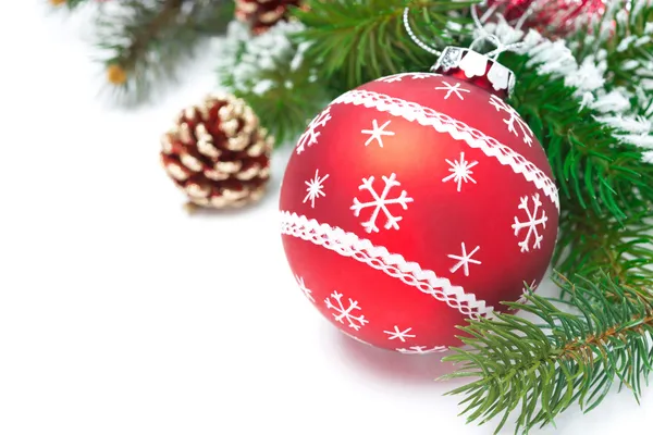 Composition with red Christmas ball and fir branches isolated — Stock Photo, Image