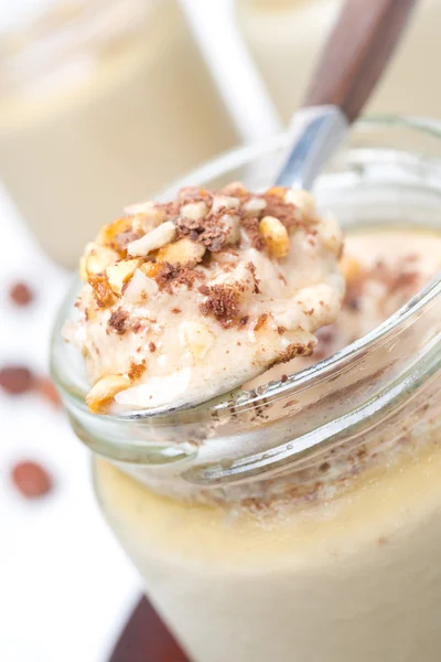 Spoon of chocolate and coffee yogurt, close-up — Stock Photo, Image