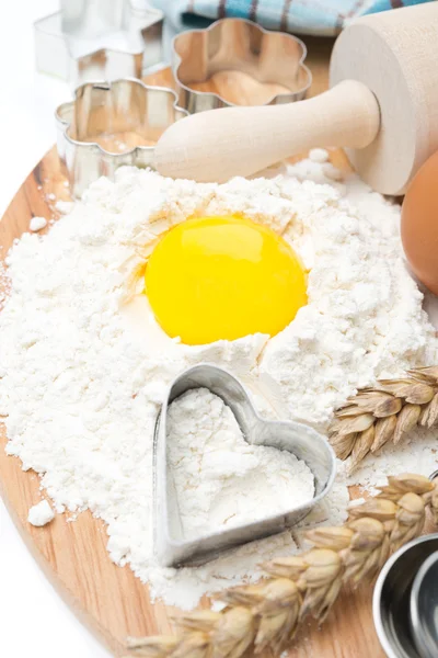 Flour, eggs, rolling pin and baking forms, top view — Stock Photo, Image