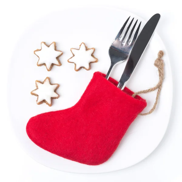 Boże Narodzenie tabeli ustawienia z czerwone buty i ciasteczka, na białym tle — Zdjęcie stockowe