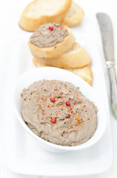 Liver pate with pink pepper in a white bowl — Stock Photo, Image