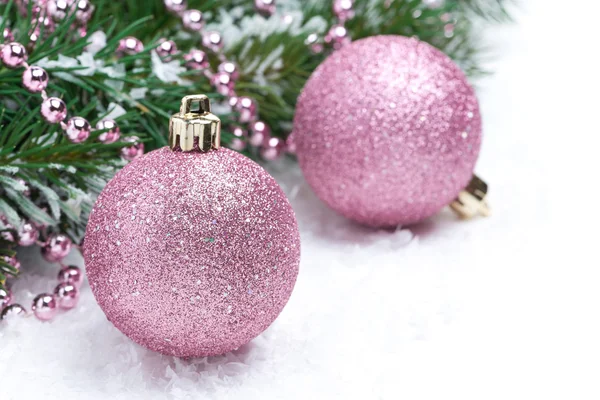 Pink christmas balls and spruce branches, selective focus — Stock Photo, Image