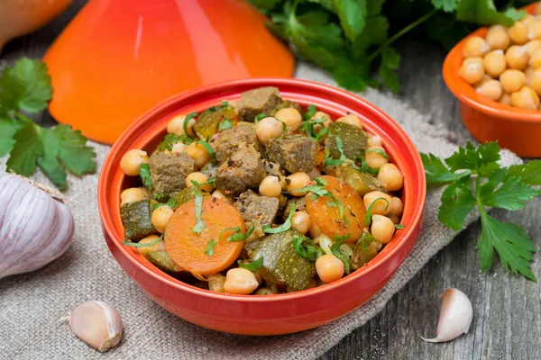 Tagine with beef, chickpeas, vegetables and herbs, top view — Stock Photo, Image