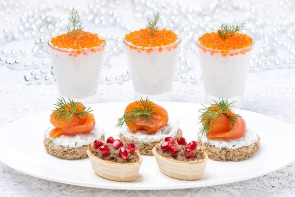 Holiday appetizers - canape with salmon, tartlet with liver pate — Stock Photo, Image
