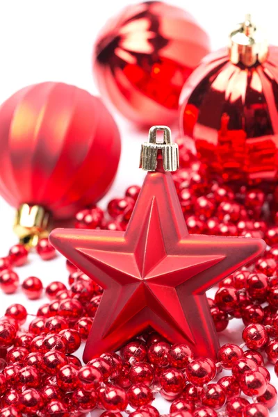 Red Christmas decorations - the star and balls — Stock Photo, Image