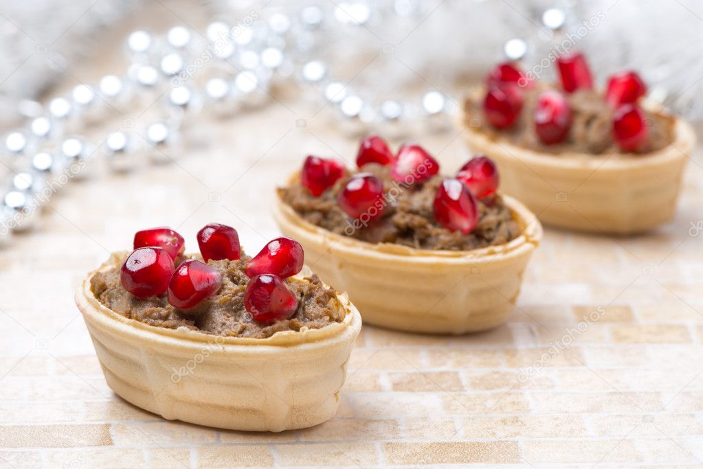 Tartlets with liver pate and pomegranate seeds for Christmas