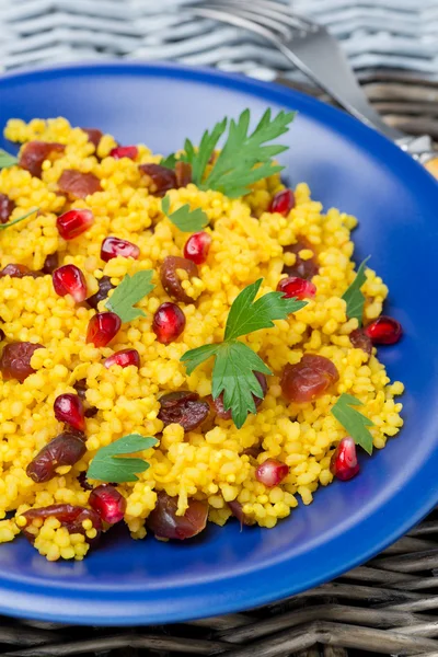 Couscous salad with curry, dried cranberries and herbs, vertical — Stock Photo, Image