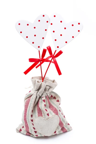 Wooden heart on a stick in the sack, isolated — Stock Photo, Image