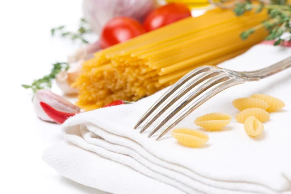Fork, napkin, pasta and spices, selective focus, isolated — Stock Photo, Image