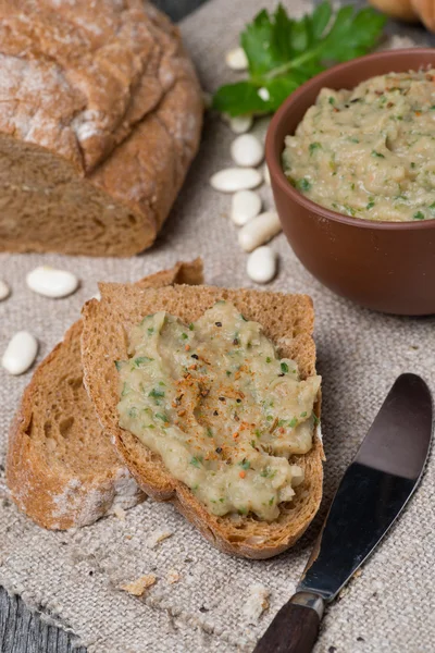 Rustic bread with bean pate, vertical — Stock Photo, Image