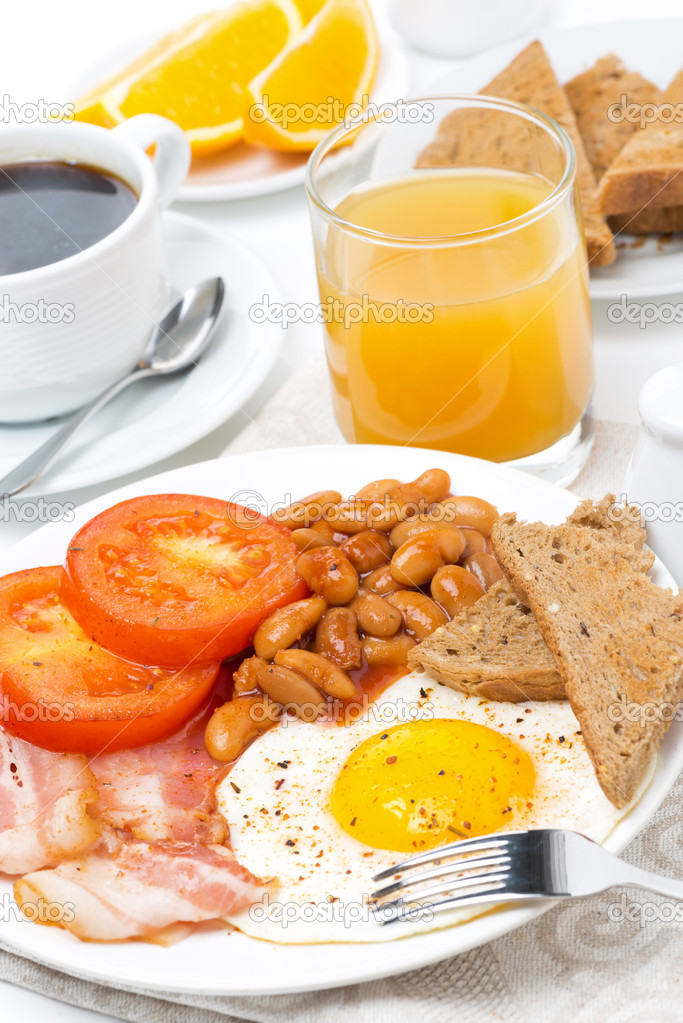 Traditional English breakfast with fried eggs, bacon, beans