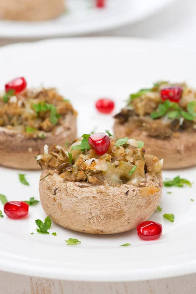 Appetizer - stuffed mushrooms with herbs and pomegranate seeds — Stock Photo, Image