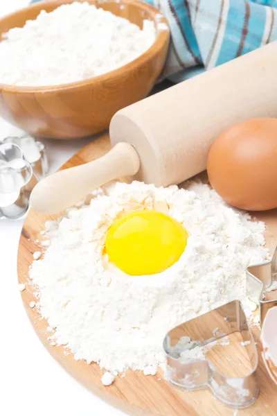 Ingredients for baking cookies - flour, egg and baking forms — Stock Photo, Image