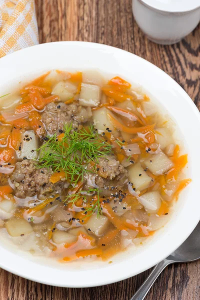 Delicious vegetable soup with meatballs, vertical — Stock Photo, Image