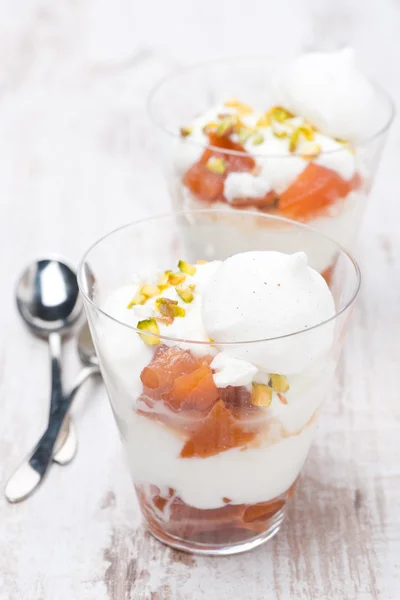 dessert with peaches, whipped cream and meringue