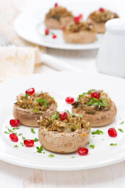 Appetizer - stuffed mushrooms with herbs and pomegranate seeds — Stock Photo, Image