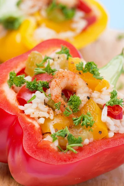 Stuffed peppers with salad of rice and shrimp on a wooden board — Stock Photo, Image