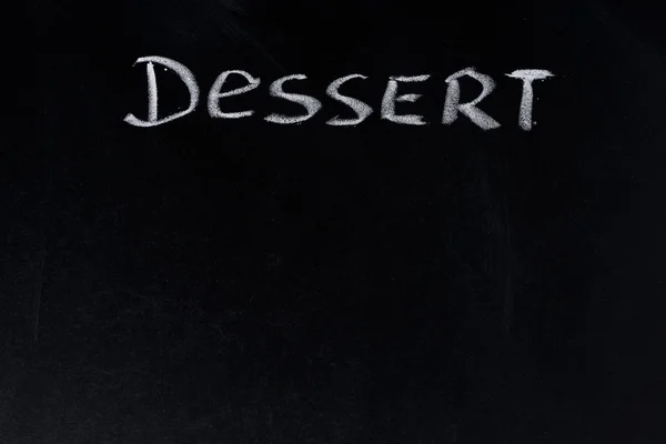 Le mot dessert écrit à la craie sur un tableau noir — Photo