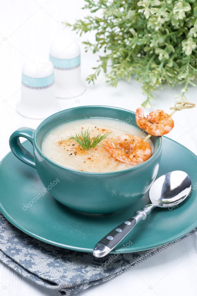 potato cream soup with shrimps on a skewer