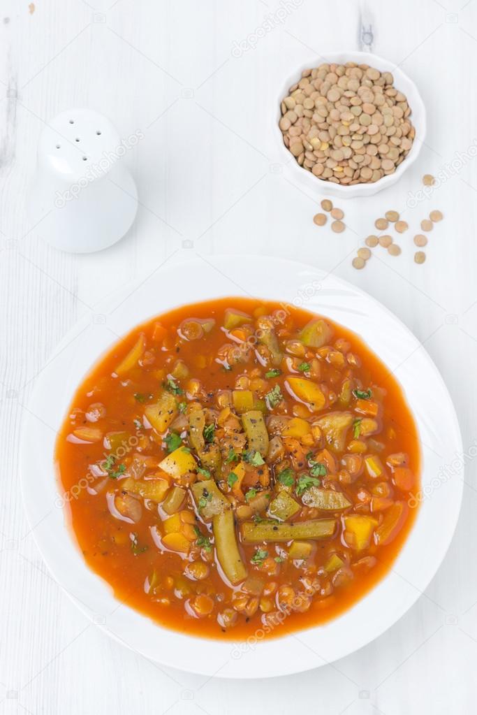 tomato soup with green lentils and vegetables, top view