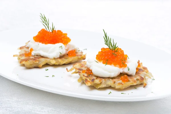 Potato pancakes with caviar on the plate — Stock Photo, Image