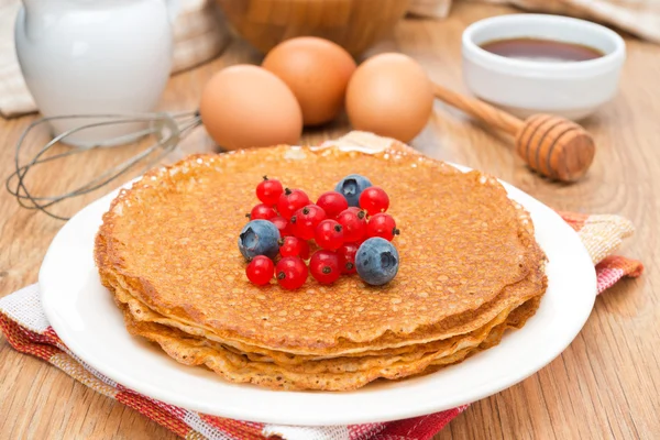 Crepes with fresh berries and ingredients for baking, horizontal — Stock Photo, Image