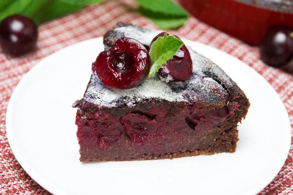 Piece of chocolate Clafoutis with cherries, close-up — Stock Photo, Image