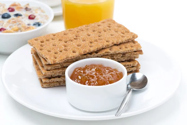 Breakfast - crisp bread with jam, orange juice and muesli — Stock Photo, Image