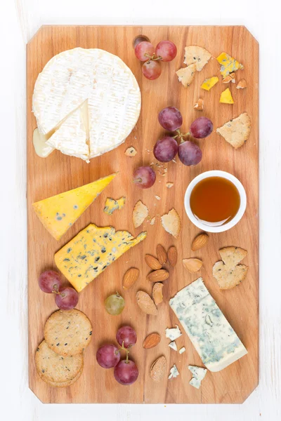 Assorted soft cheeses, grapes, nuts and honey