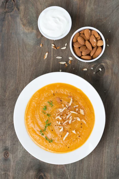 carrot soup with almonds and yogurt, top view