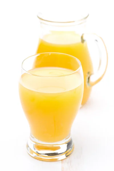 Glass and jug of orange juice — Stock Photo, Image