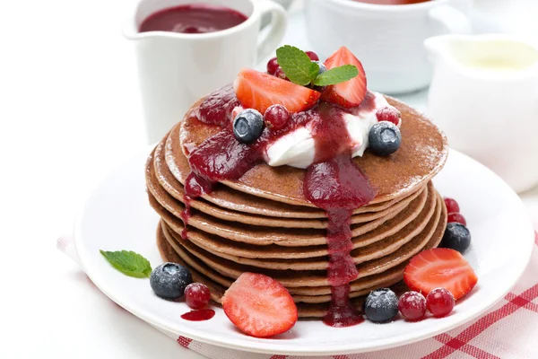 Pancakes with cream and fresh berries for breakfast, isolated — Stock Photo, Image