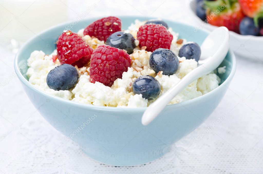 Cottage cheese with berries, honey and nuts, fresh berries