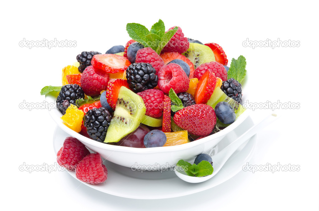 salad of fresh fruit and berries in a bowl isolated