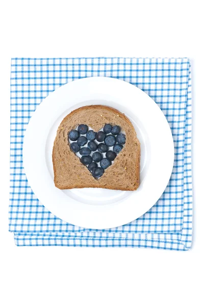A piece of bread with the middle filled with blueberries — Stock Photo, Image