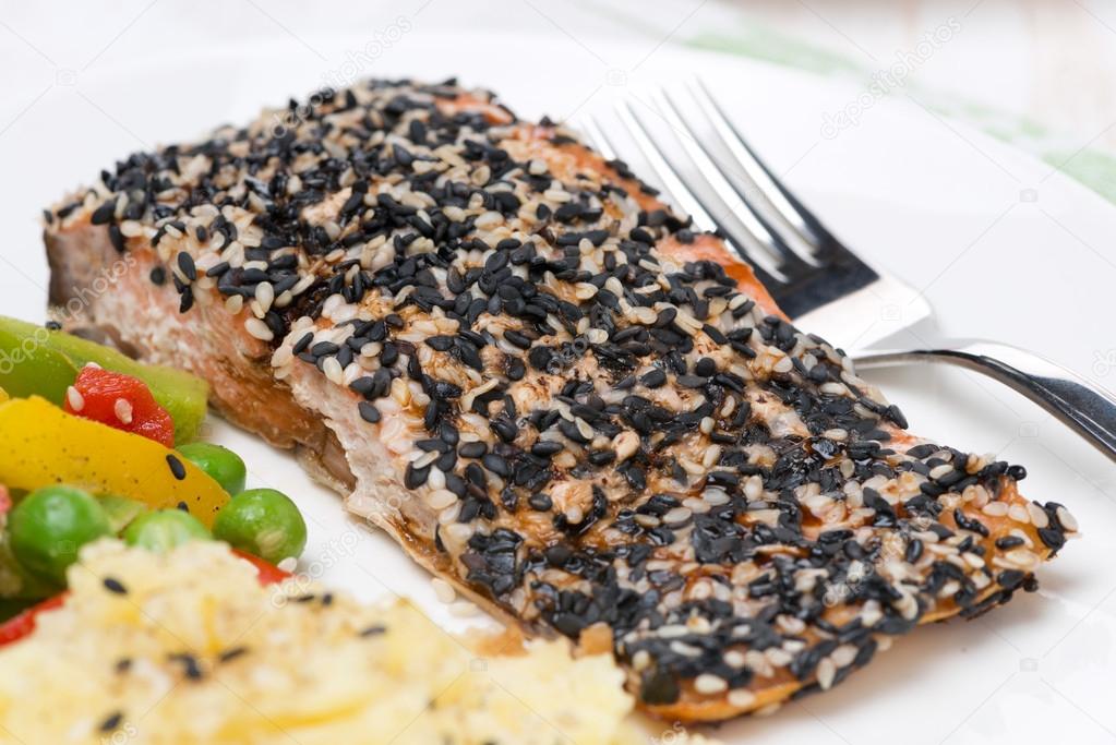 pink salmon fillet in sesame breaded, close-up