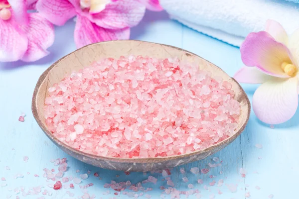 pink sea salt, flowers and towels for the spa