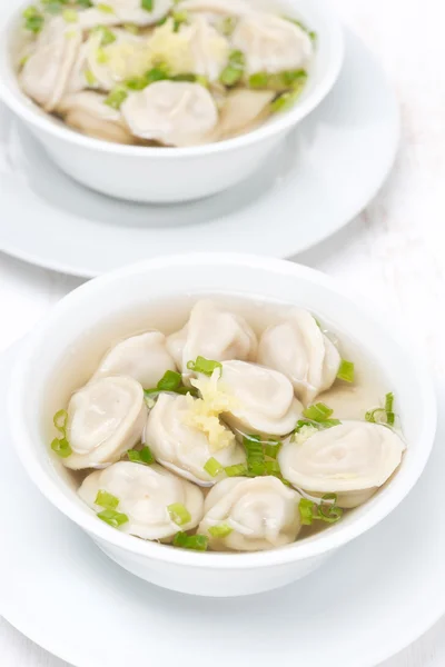 Chicken broth with Chinese dumplings, top view — Stock Photo, Image