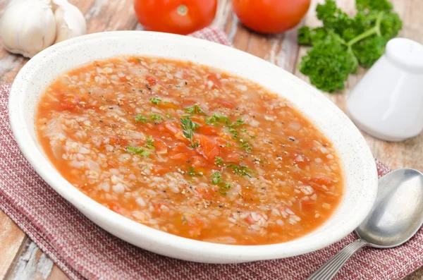 Plate of tomato soup with buckwheat — Stock Photo, Image