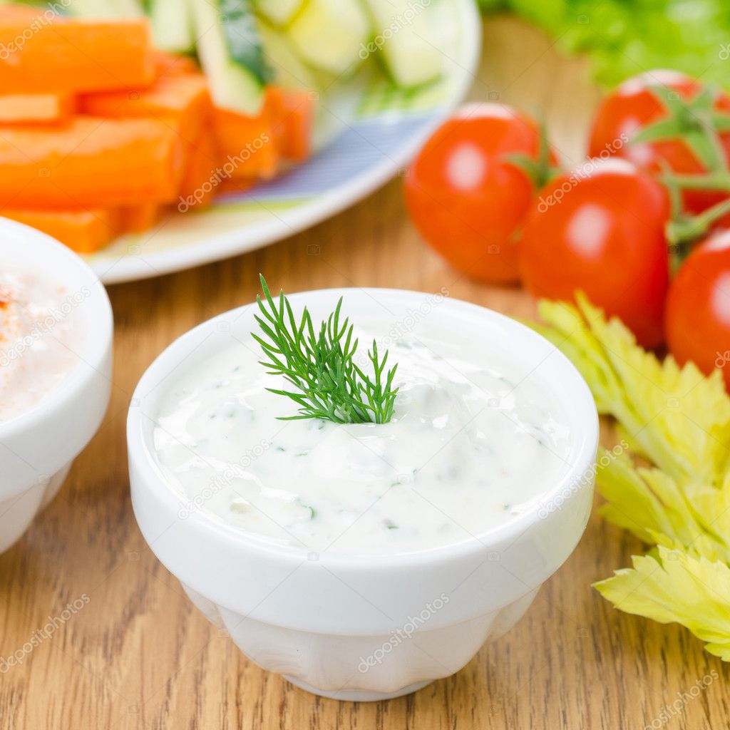 yoghurt sauce with herbs to assorted fresh vegetables