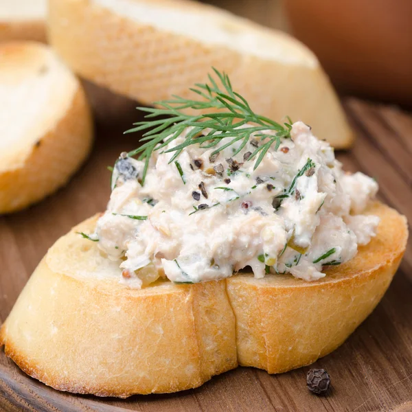 Pate of herring with sour cream on a piece of baguette — Stock Photo, Image