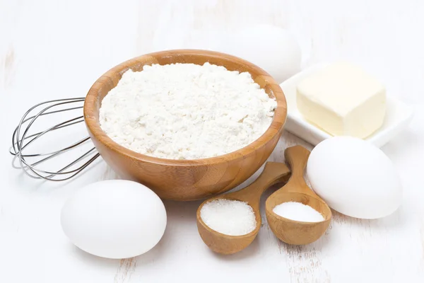 Flour, salt, sugar, butter and eggs for baking pancakes — Stock Photo, Image