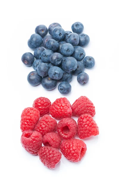 Fresh raspberries and blueberries, top view, isolated — Stock Photo, Image