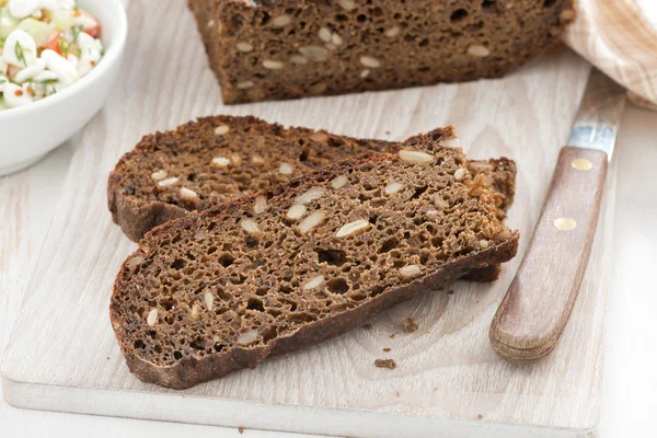 Rye bread with seeds, horizontal — Stock Photo, Image