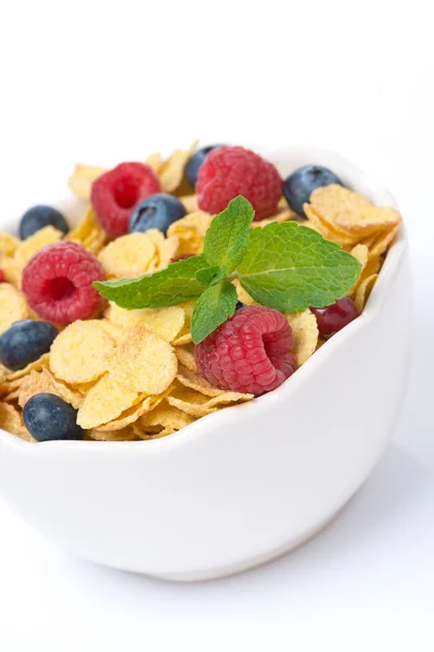 Bowl of cornflakes with fresh berries and mint, selective focus — Stock Photo, Image