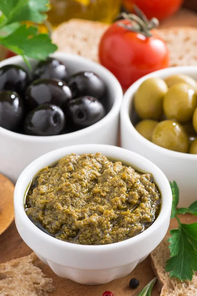 Assortment of antipasti - pesto, olives, fresh vegetables — Stock Photo, Image