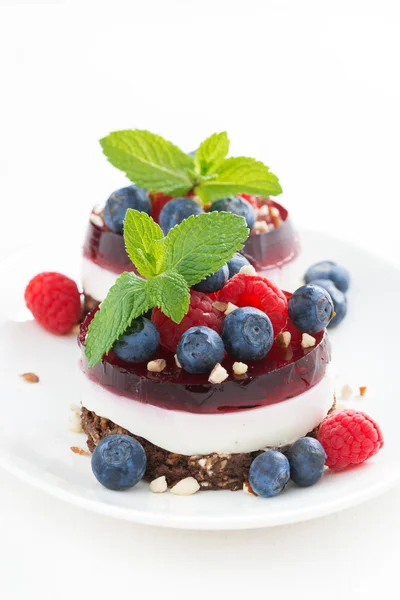 Cakes with fruit jelly and fresh berries — Stock Photo, Image