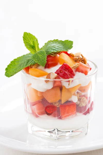 Dessert with strawberries, apricots, whipped cream and granola — Stock Photo, Image