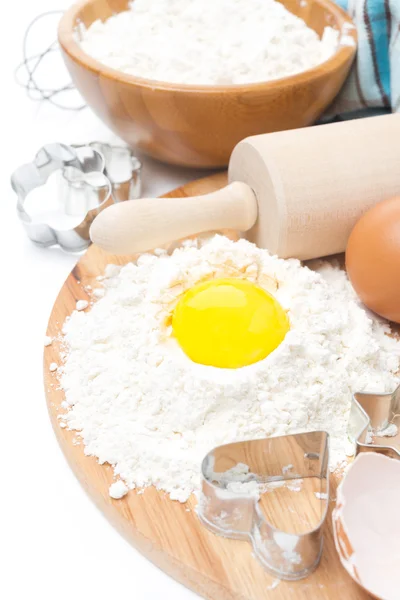 Ingredients for baking cookies - flour, egg and baking forms — Stock Photo, Image