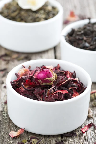 Dry herbal teas in white bowls, close-up — Stock Photo, Image